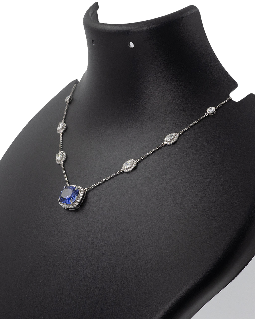 Cushion-cut blue sapphire with diamond halo in 14k yellow gold necklace