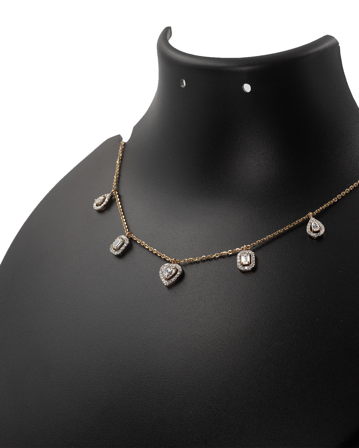 Necklace with heart-shaped pendants on a black mannequin bust