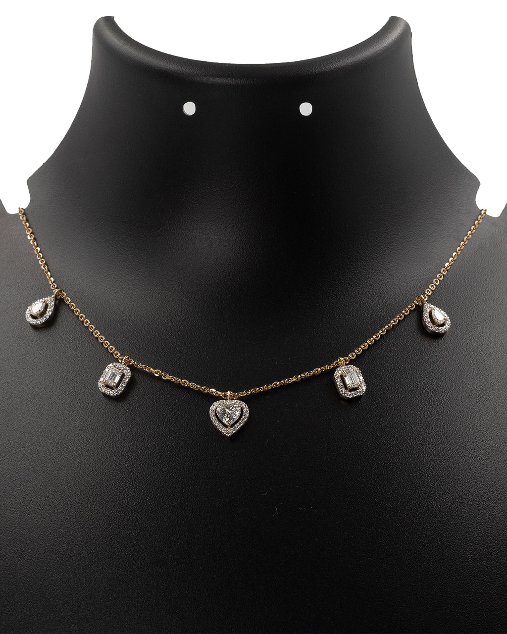 Necklace with heart and teardrop pendants on a black mannequin bust.