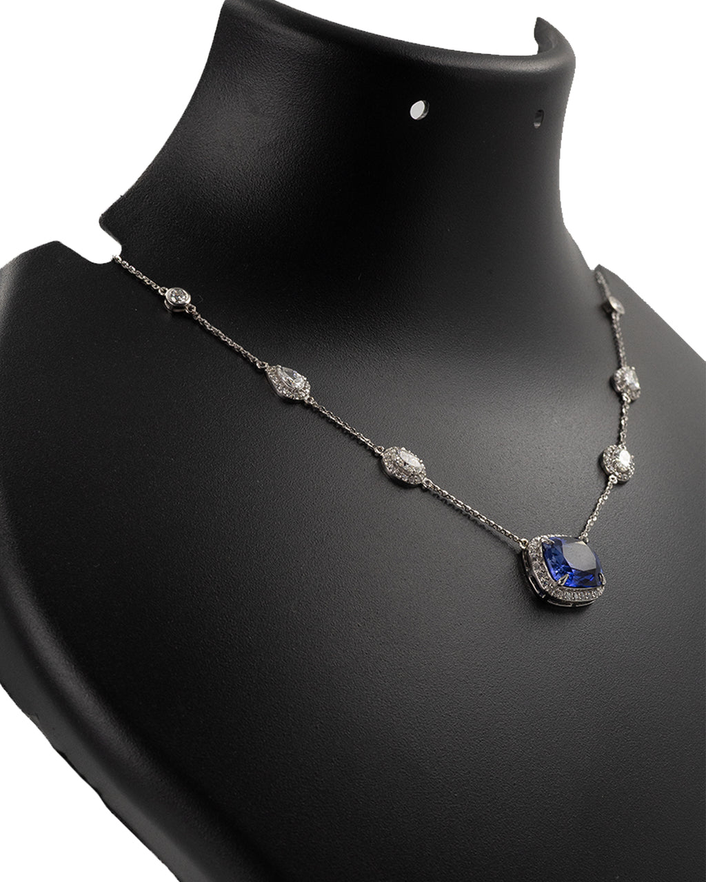 Diamond station chain detail on blue sapphire necklace