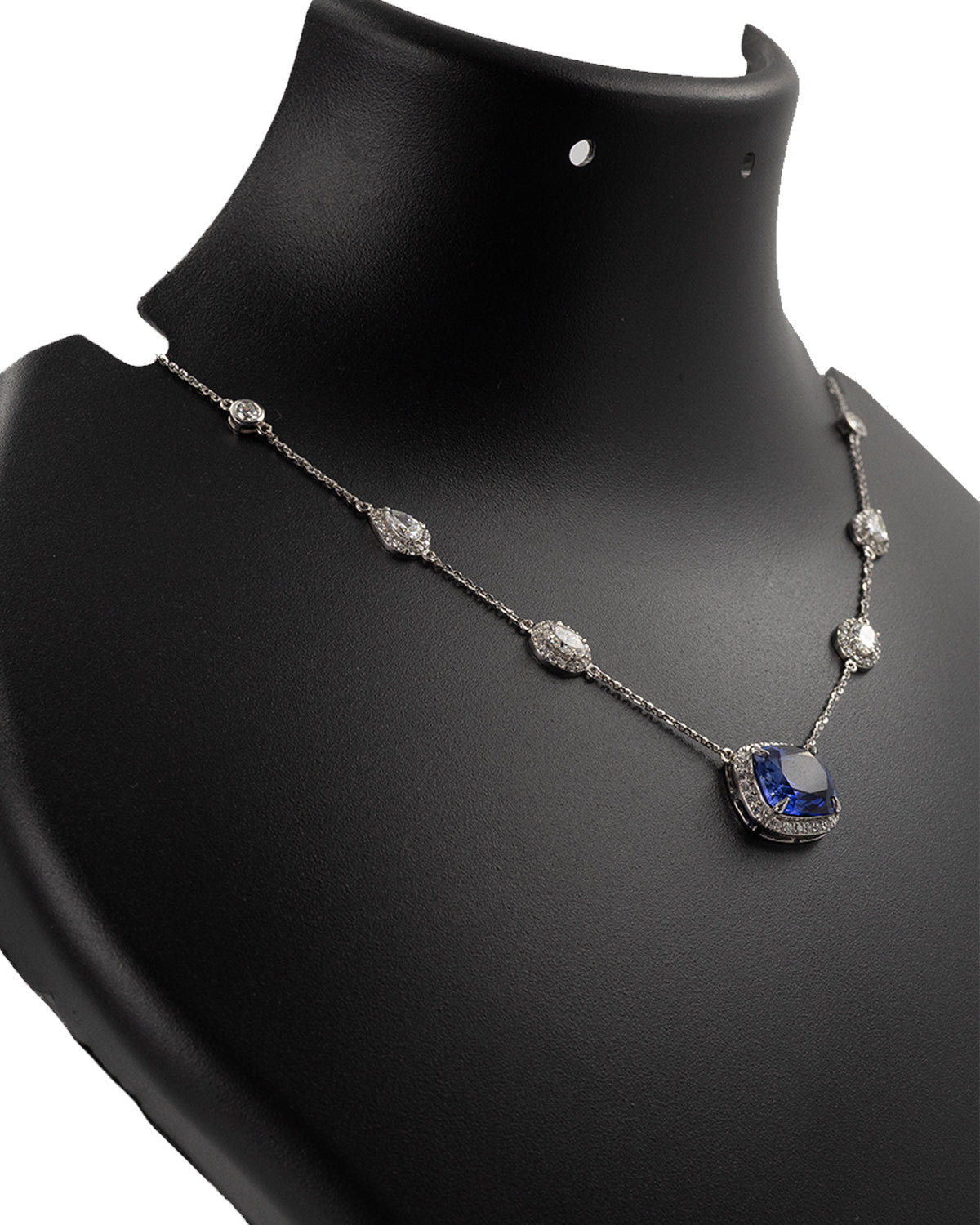 Diamond station chain detail on blue sapphire necklace