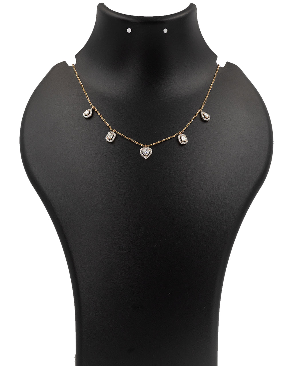 Gold necklace with heart-shaped pendants on a black mannequin bust.