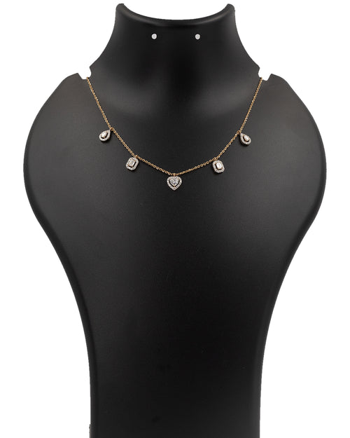 Gold necklace with heart-shaped pendants on a black mannequin bust.